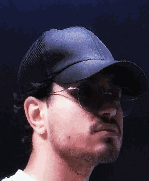 Nikan wearing a black cap and sunglasses